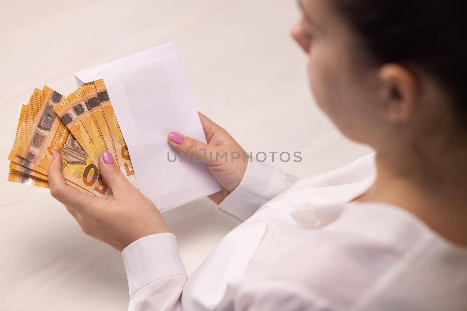 Euro banknotes in white envelope. Businesswoman counting paper currency, great cash income and profit. Financial investment in future, money exchange concept. Cash money calculations.