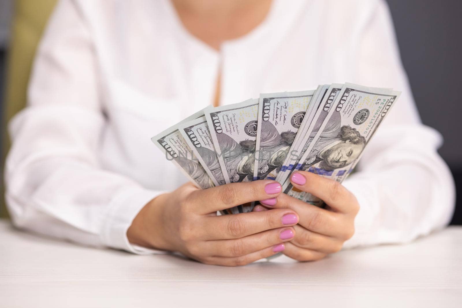 Woman counting dollar bills. Close up of female hands count money cash. Money calculation. Employee salary. Cash money payment Successful business concept. American currency exchange in bank