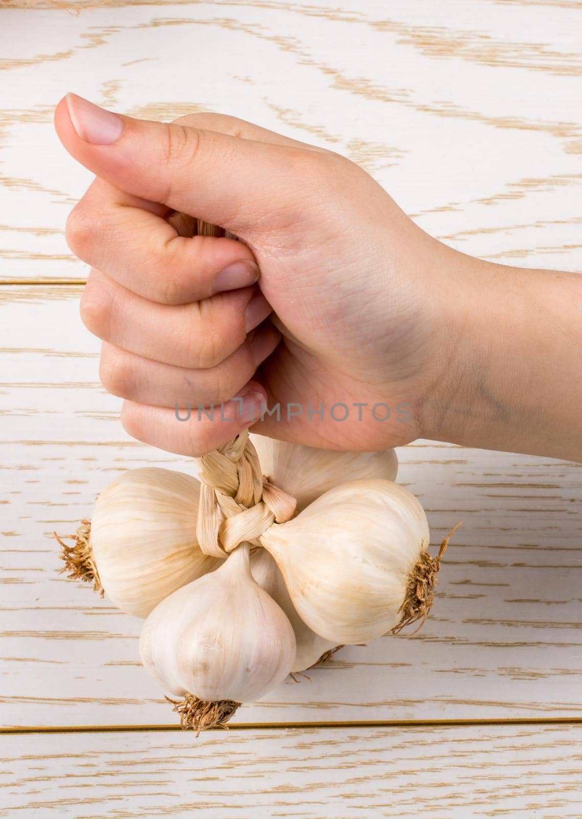 Cloves of garlic in hand  in view by berkay
