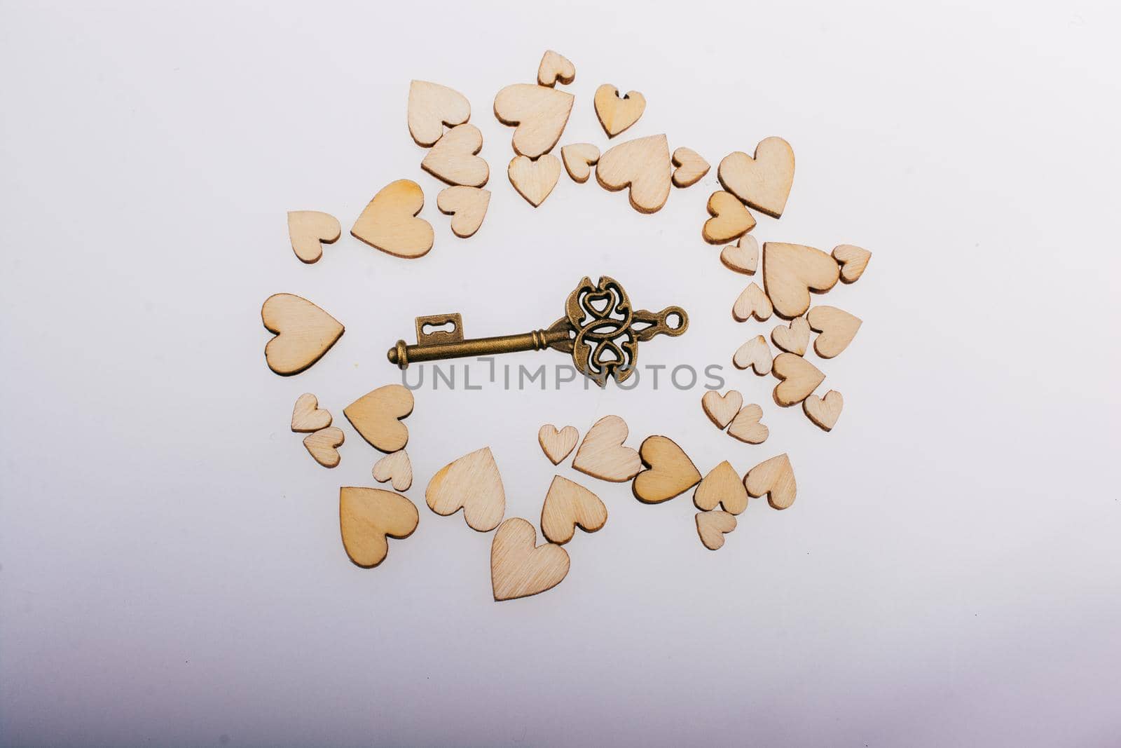 Retro  style heart shaped key on wooden hearts