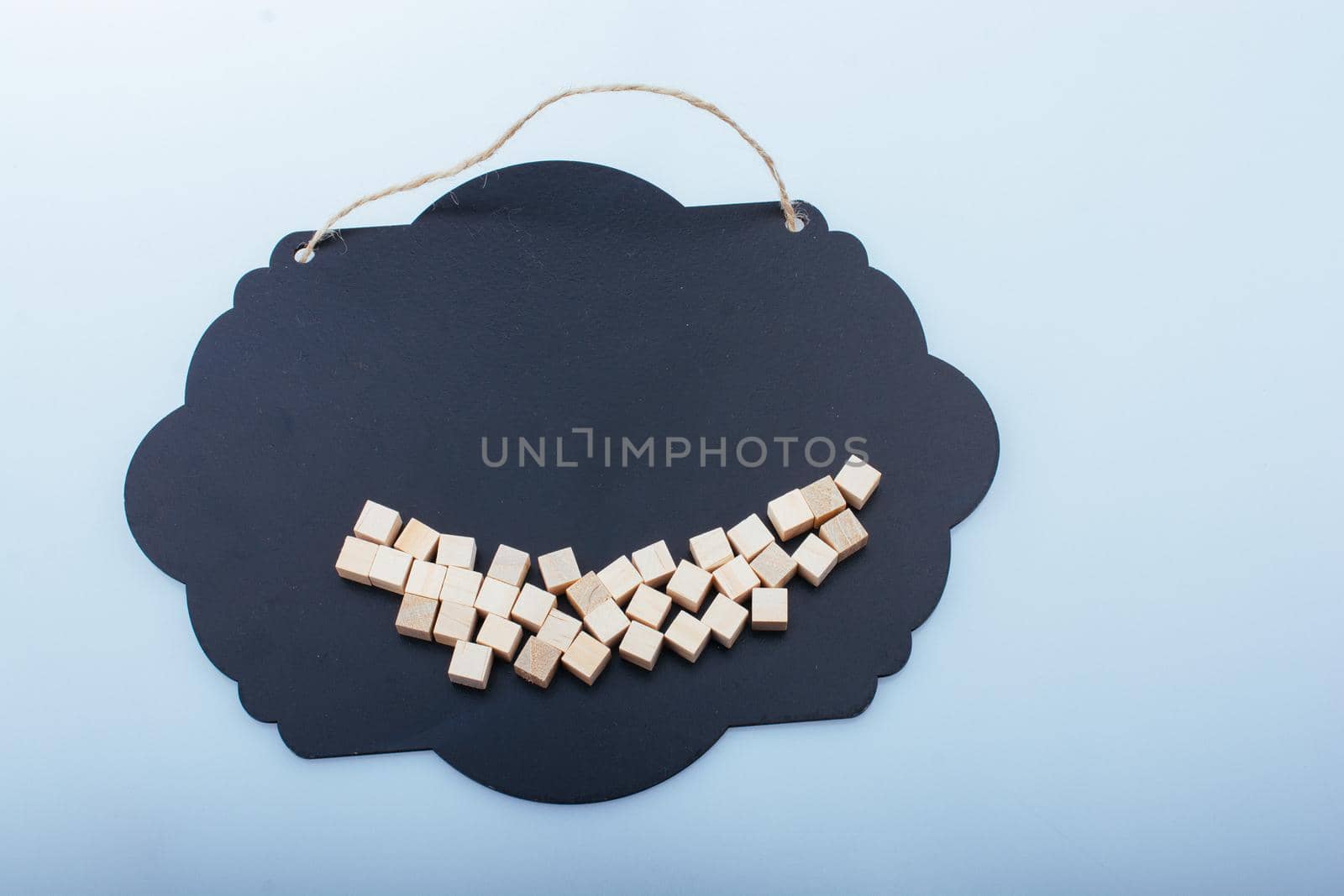Wooden toy cubes as  educational game object on wooden background by berkay