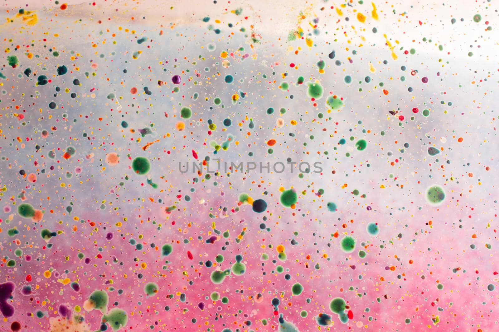 Dotted background formed by splashing watercolor paint by berkay