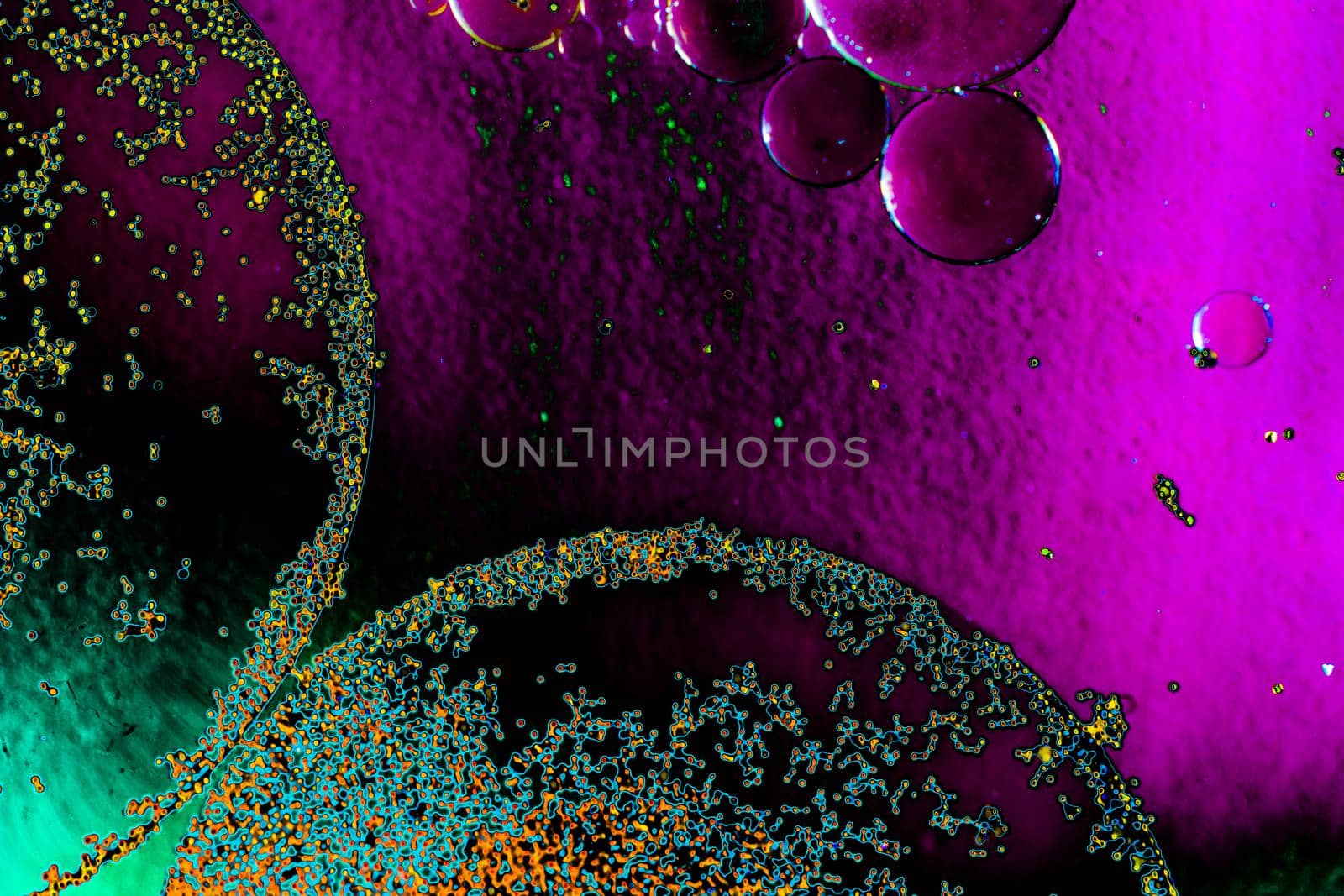 Macro shot of oil bubbles over colored background by berkay