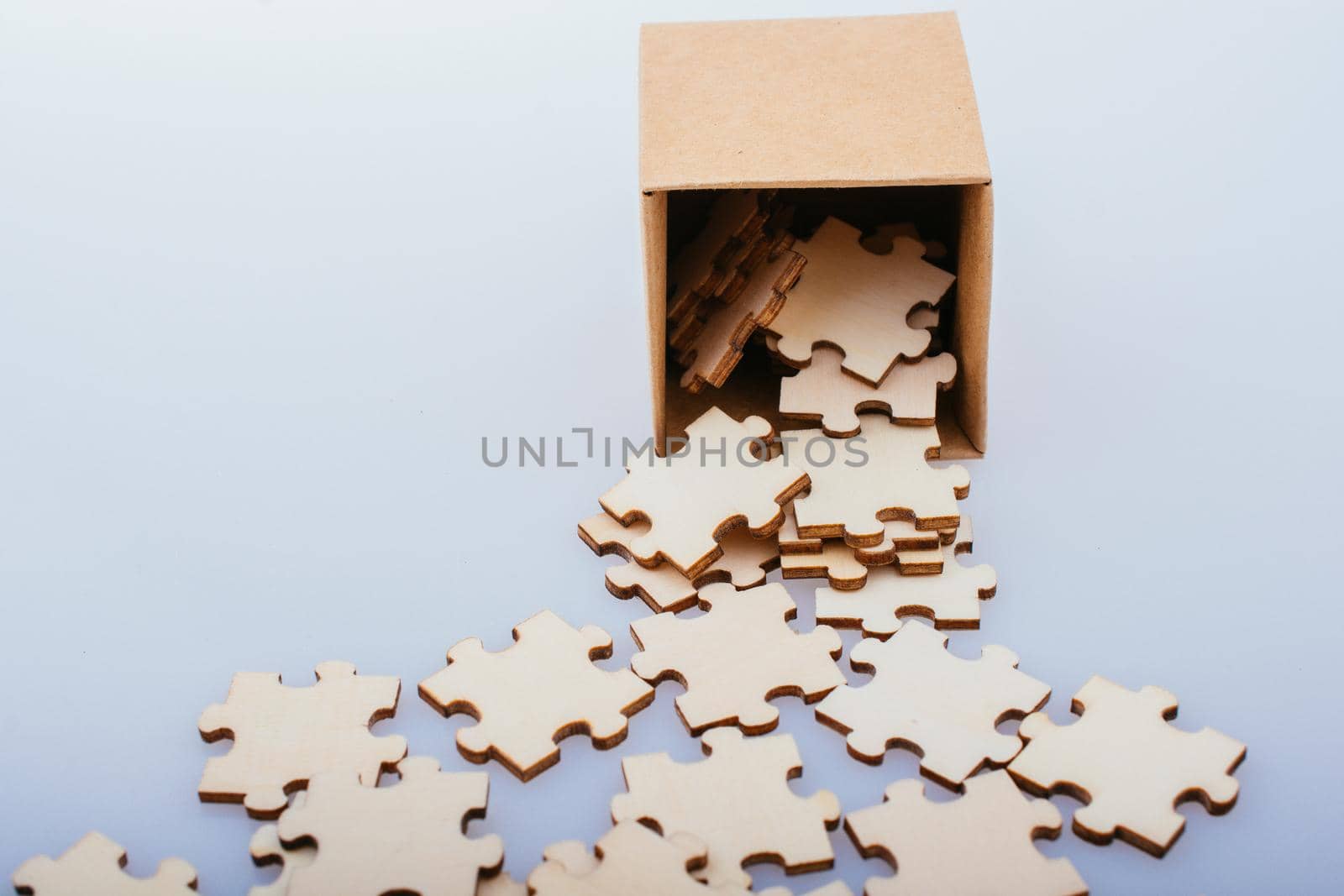Pieces of jigsaw puzzle coming out of box as business solution concept