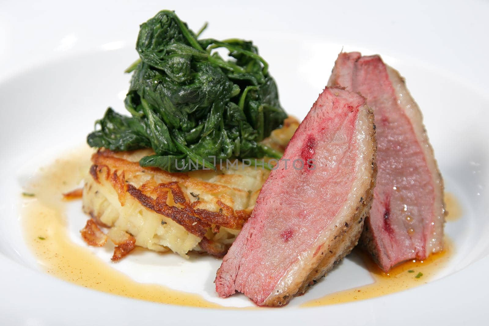 A lamb loin with spinach and potato rosti
