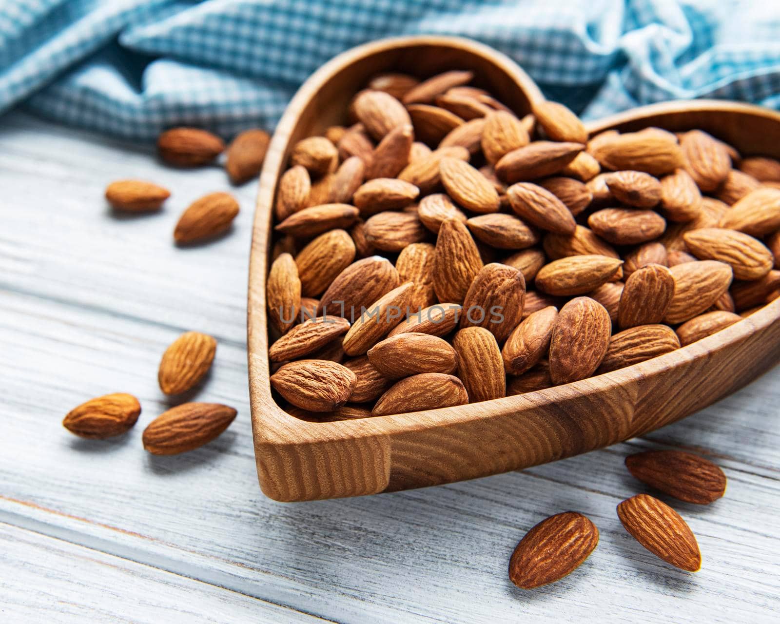 Almonds in brown bowl by Almaje
