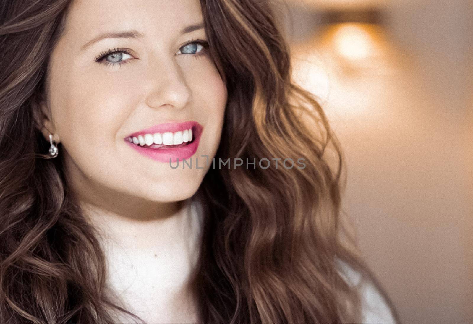 Winter portrait and Christmas holiday look. Beautiful woman in white sweater with long brown hair and glamour makeup, hairstyle model and xmas fashion.