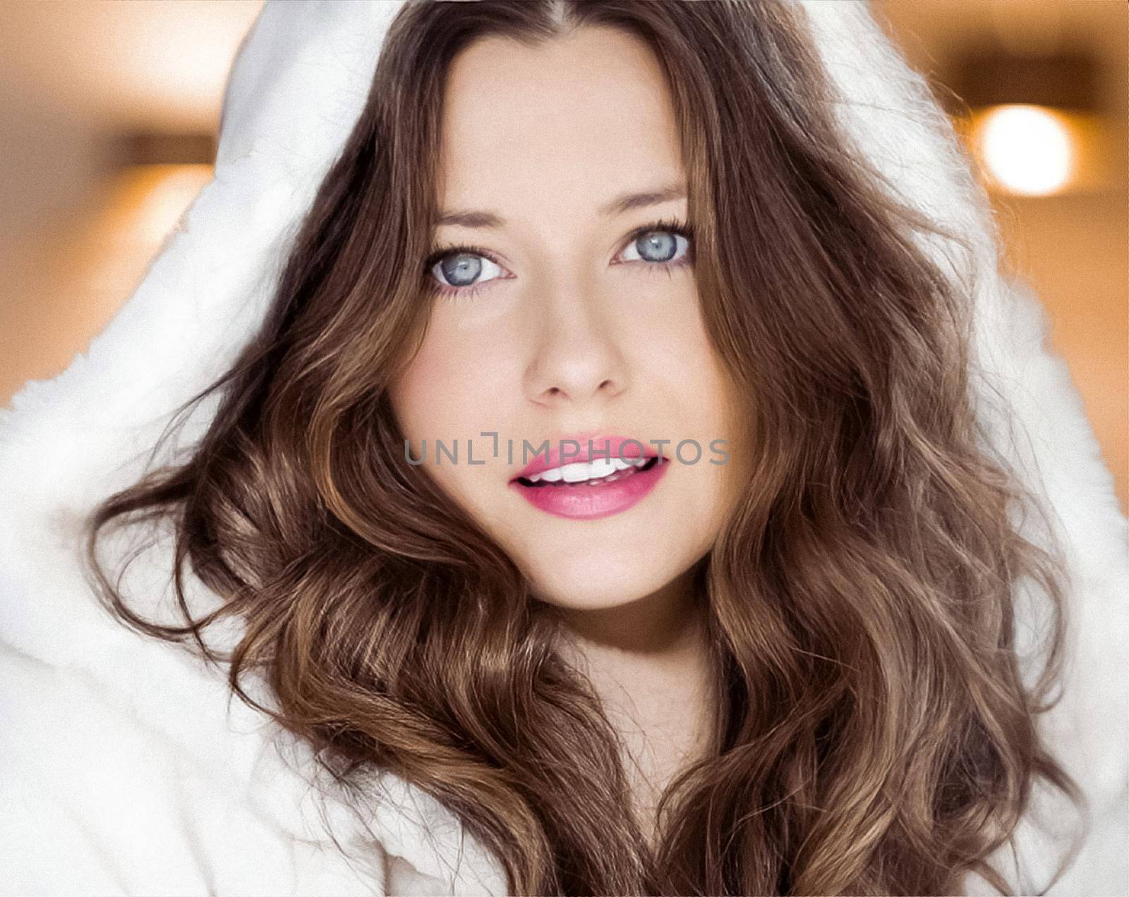 Winter fashion and Christmas holiday look. Beautiful woman wearing white sweater and fluffy fur coat with hood wrap, glamour makeup and hairstyle as xmas portrait.