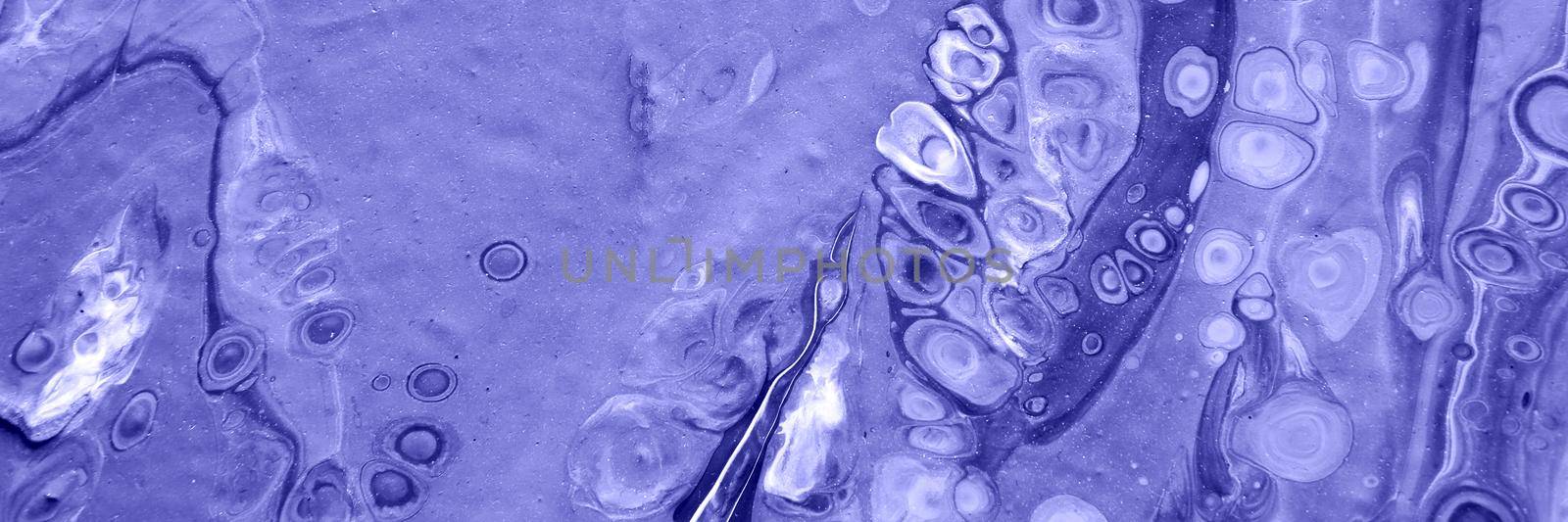 Spread-out acrylic paint. Abstract background, made in the technique of fluid art. Demonstrating the colors of 2022 - Very Peri.