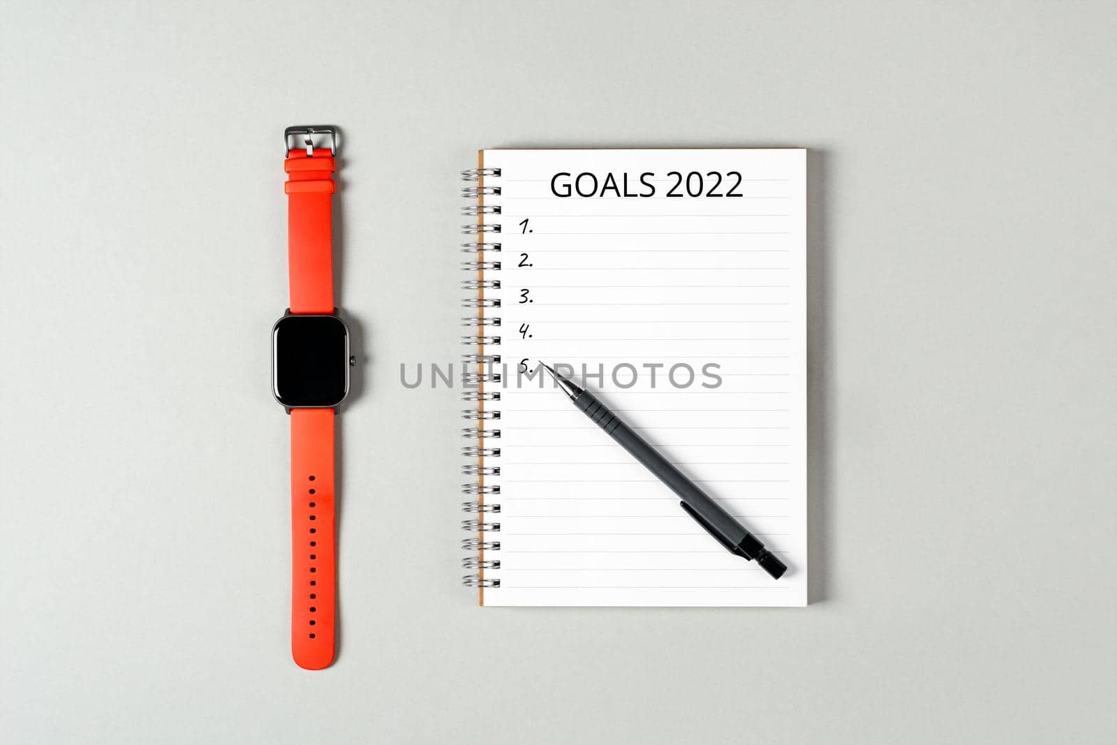 2022 goals concept banner. Notebook, pencil and a cup of black coffee isolated on gray background.