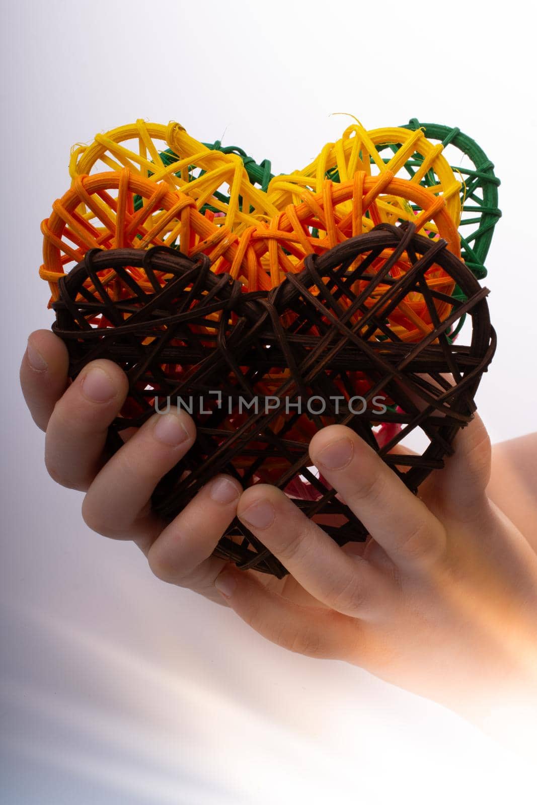 Handmade straw heart or valentines day object in hand