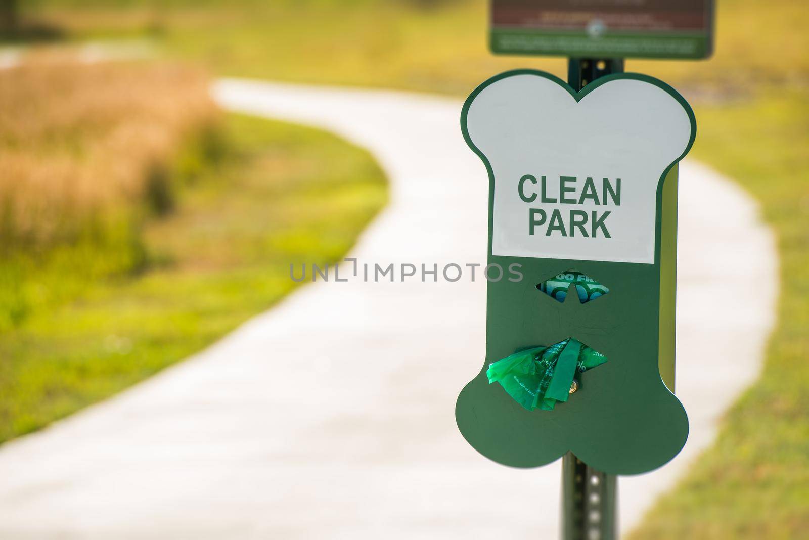 Poo Free Park Sign. Free Vinyl Bags For Dog Owners.