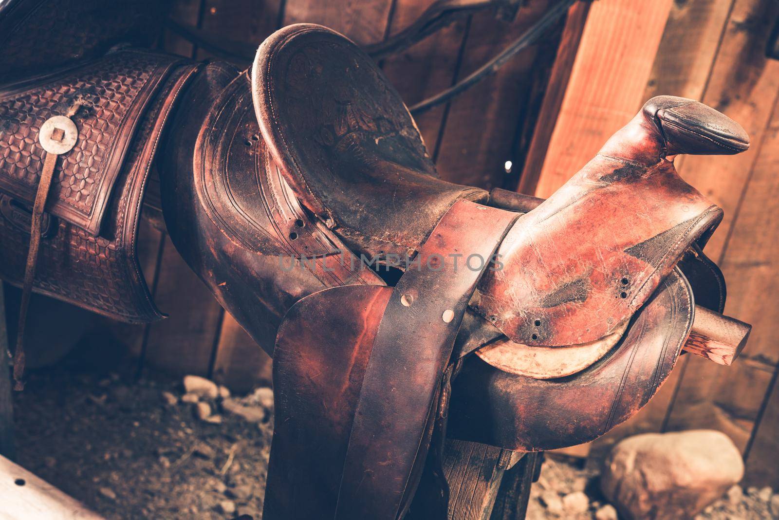 Brown Leather Saddle Closeup. Aged Western Style Saddle. by welcomia