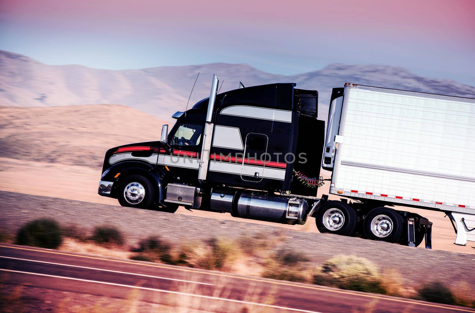 Semi Truck on the Highway. Speeding Semi Truck Somewhere in Nevada, United States.