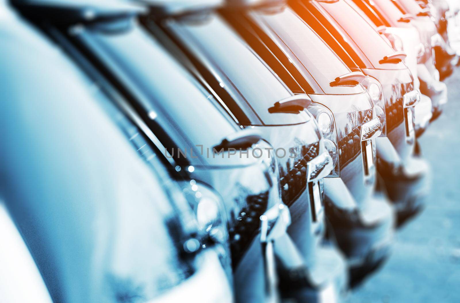 New Vehicles in Stock Closeup Photo with Color Grading. Brand New Cars For Sale in a Row. Cars Industry. by welcomia