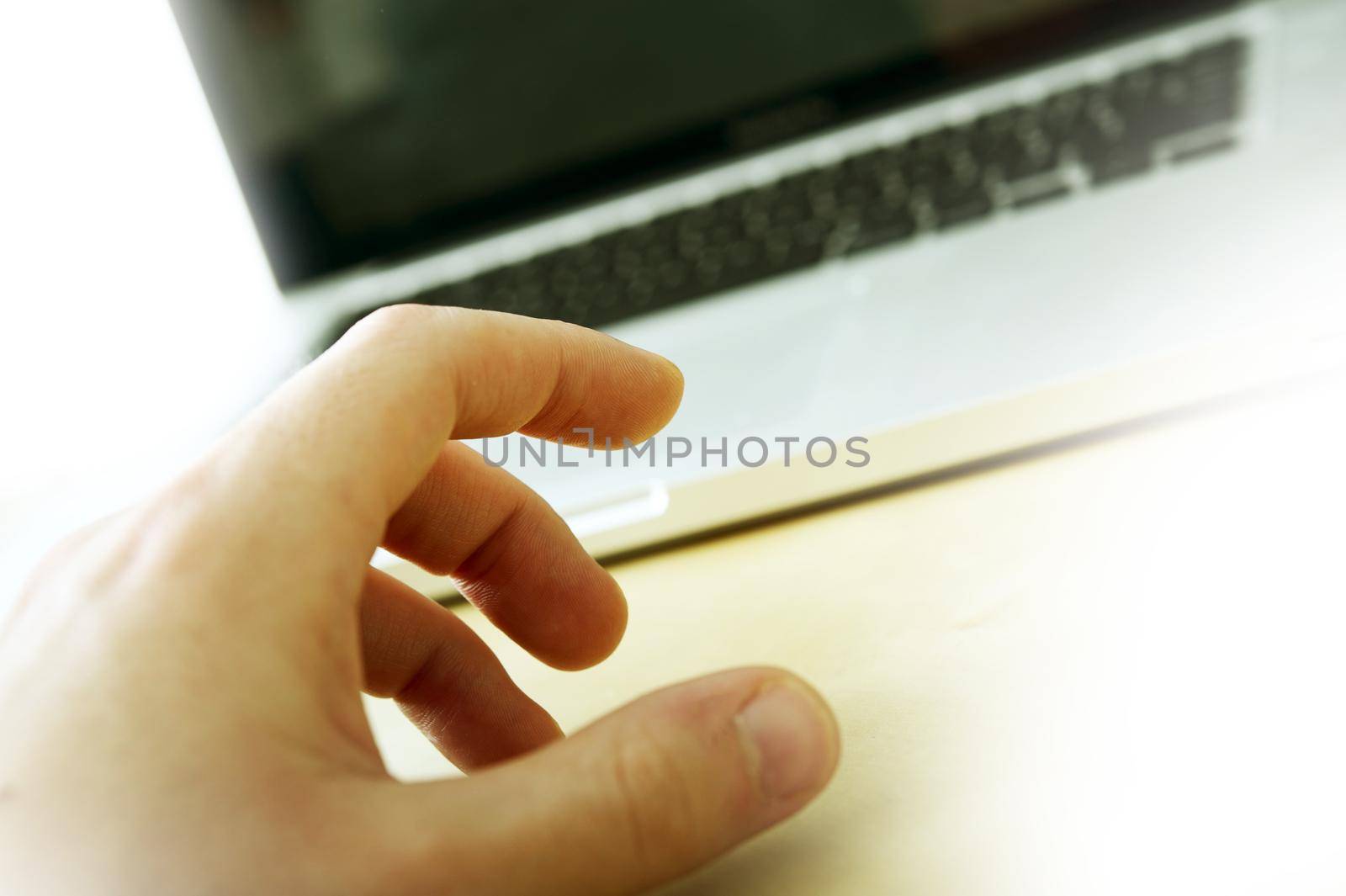 Laptop and Hand Closeup Photo. Business-Technology Theme.