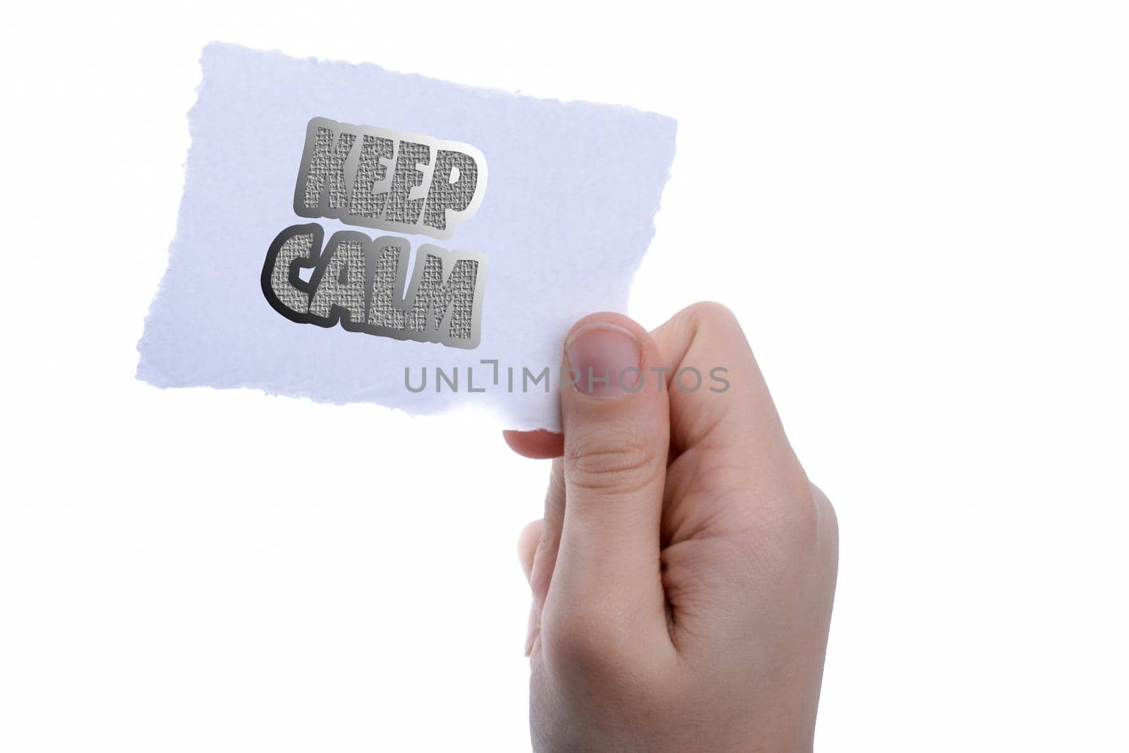 Keep calm wording hand holding a piece of blank torn notepaper