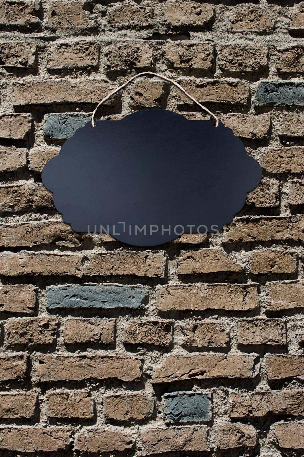 Black Empty Sign Board on brick background by berkay