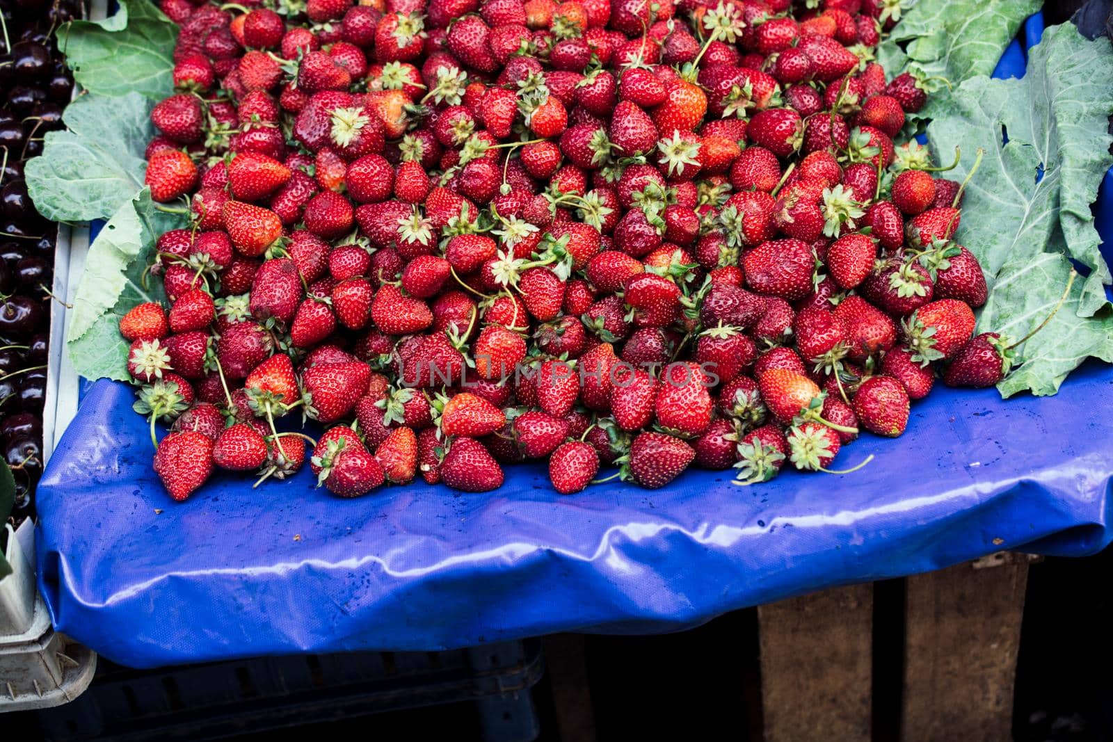 Strawberries on sale in a street bazaar by berkay