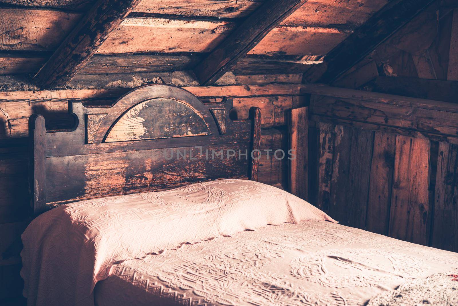 Old Wooden Cabin Bedroom. Aged Cabin Bed.