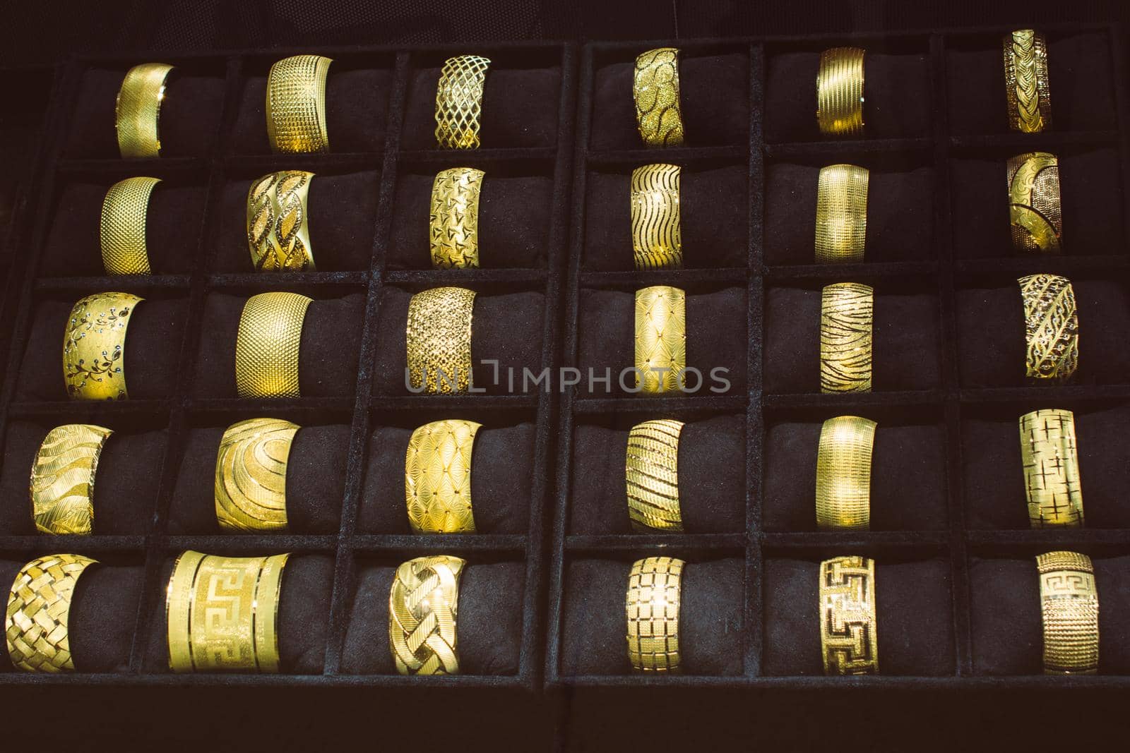 Shop display of dozens of golden bracelets by berkay