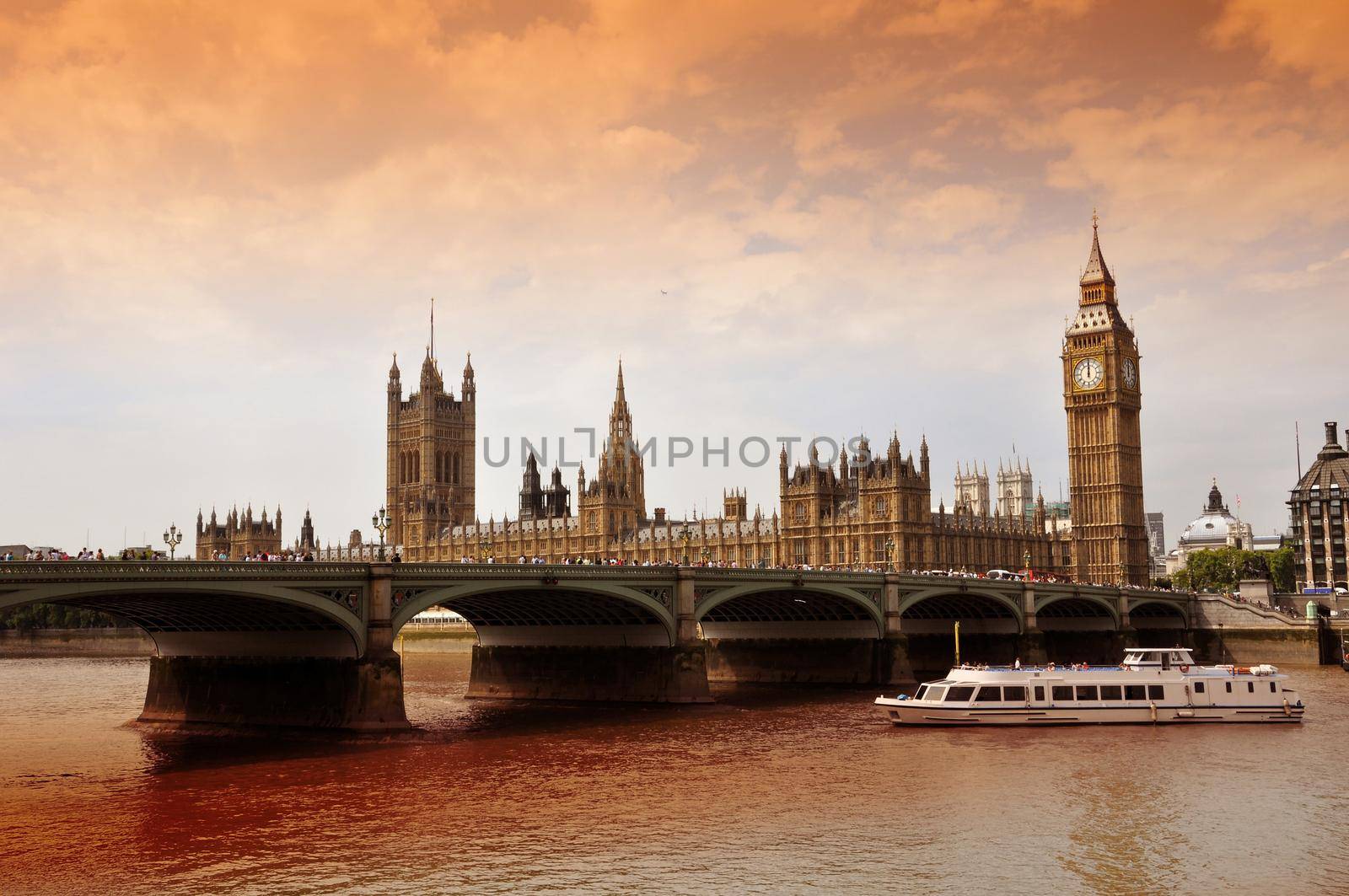 Westminster Bridge with Big Ben and the Houses of Parliament, London, United Kingdom (UK). Thames River and Touristic Boat. Horizontal Photography.