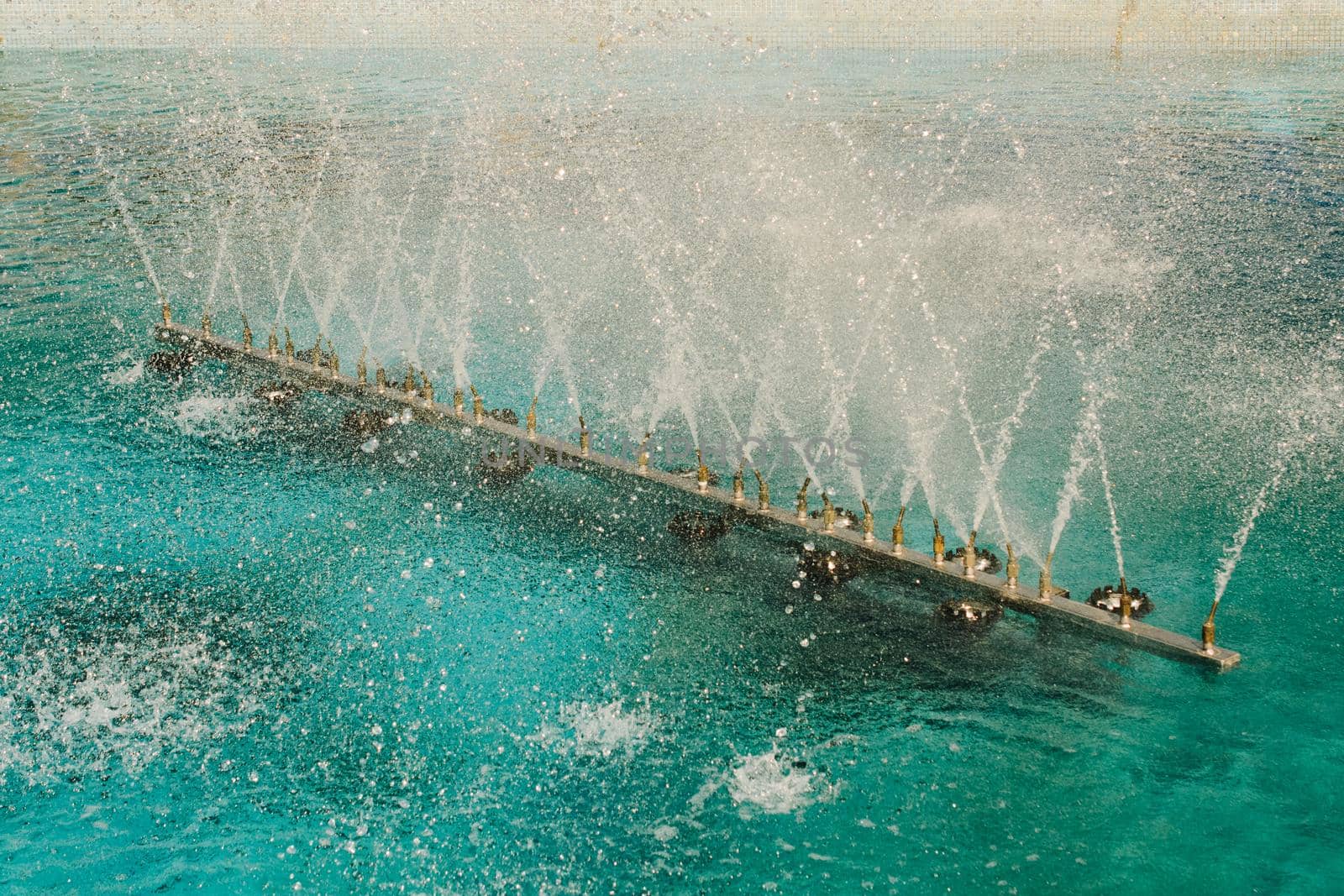 A water fountain sprinkling water on display by berkay