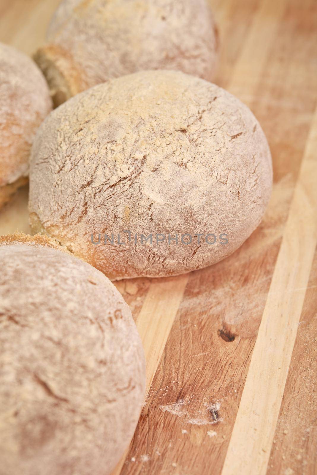 Wheat Rolls. Home-Made Wheat Rolls on Wood Board. Food Photo Collection. by welcomia