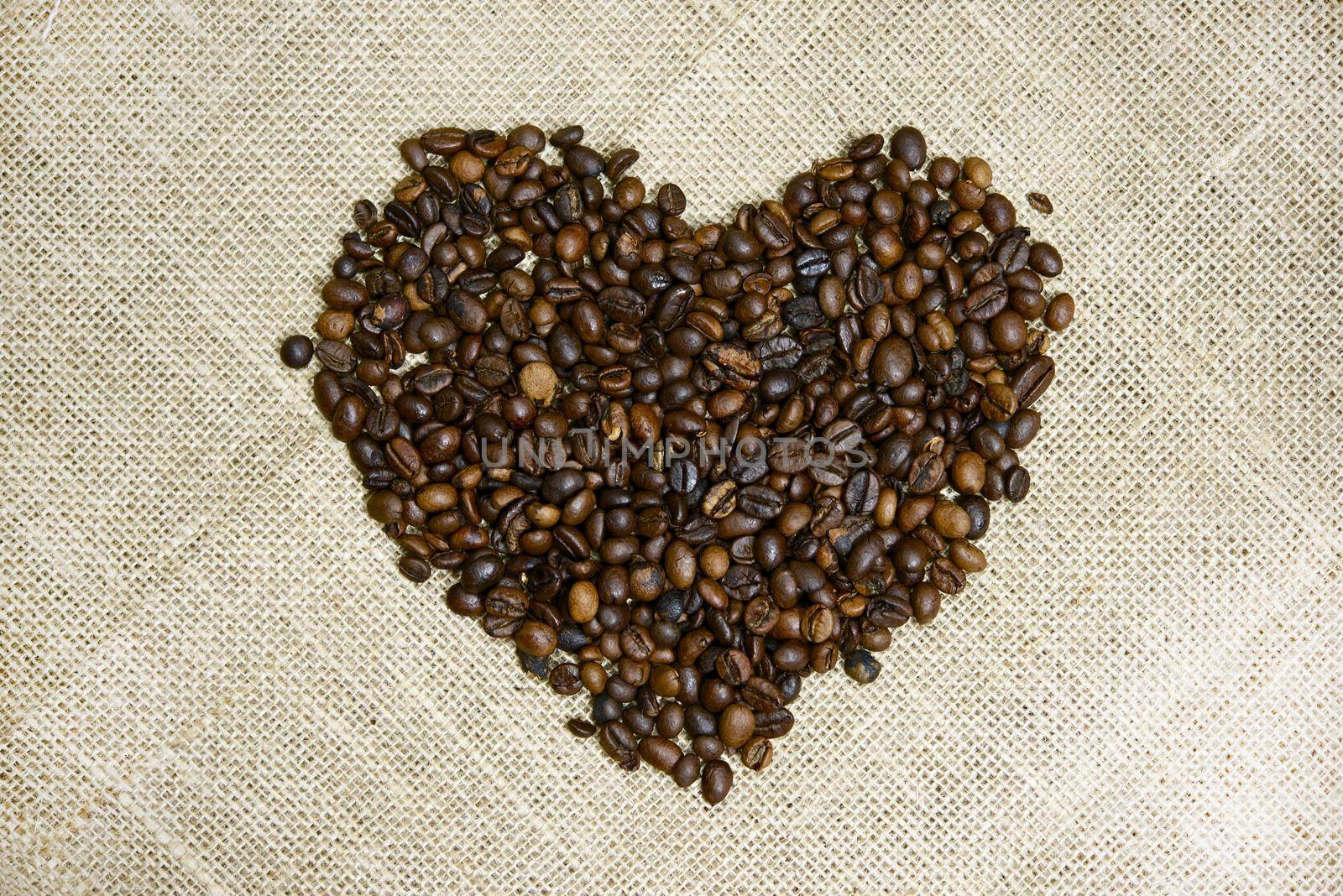 Coffee Beans Heart. Heart Shape Created From Fresh Coffee Beans - Linen Background. Drinks Photo Collection. by welcomia