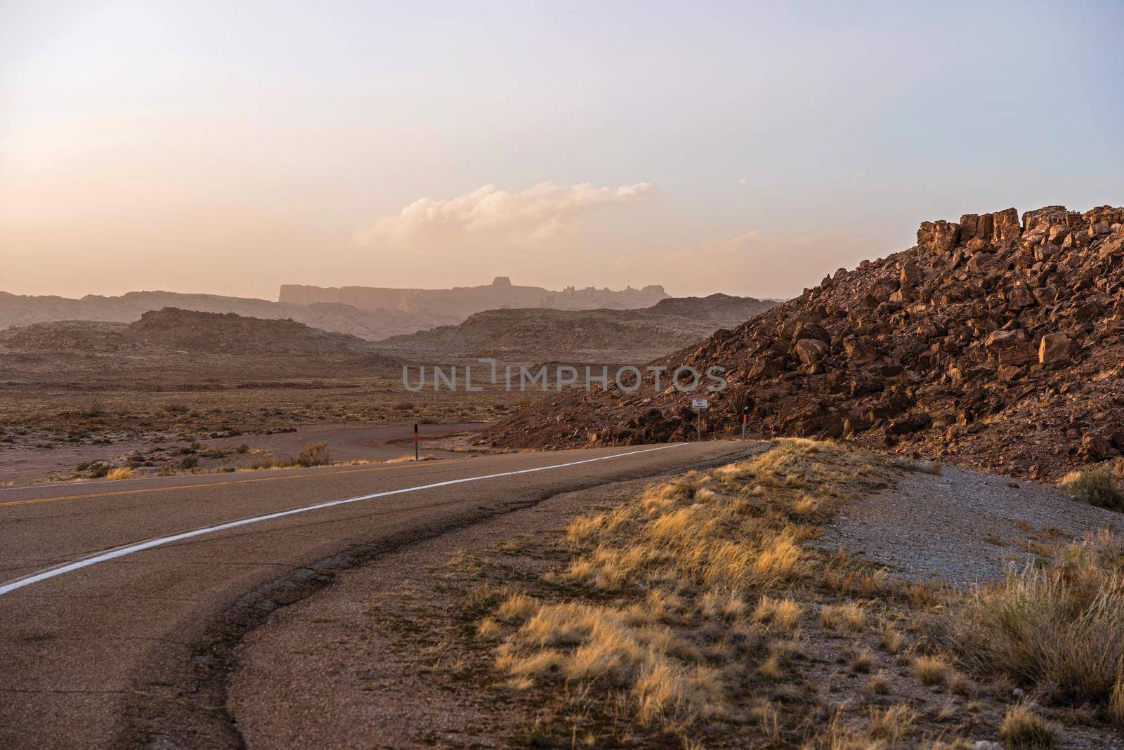 Utah Desert Road at Sunset. Raw Rocky Landscape. Utah, United State.