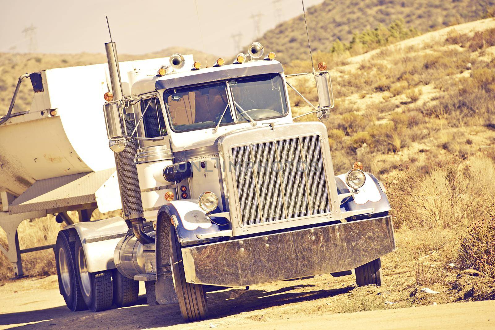 Aged American Truck in Southern California USA in Vintage Colors. Transportation and Logistics Theme. Transportation Photo Collection.
