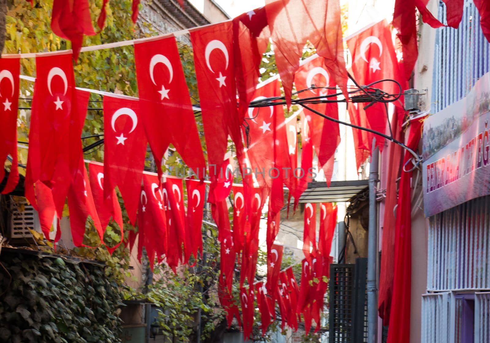 Turkish national flag hang on a rope in the street  by berkay