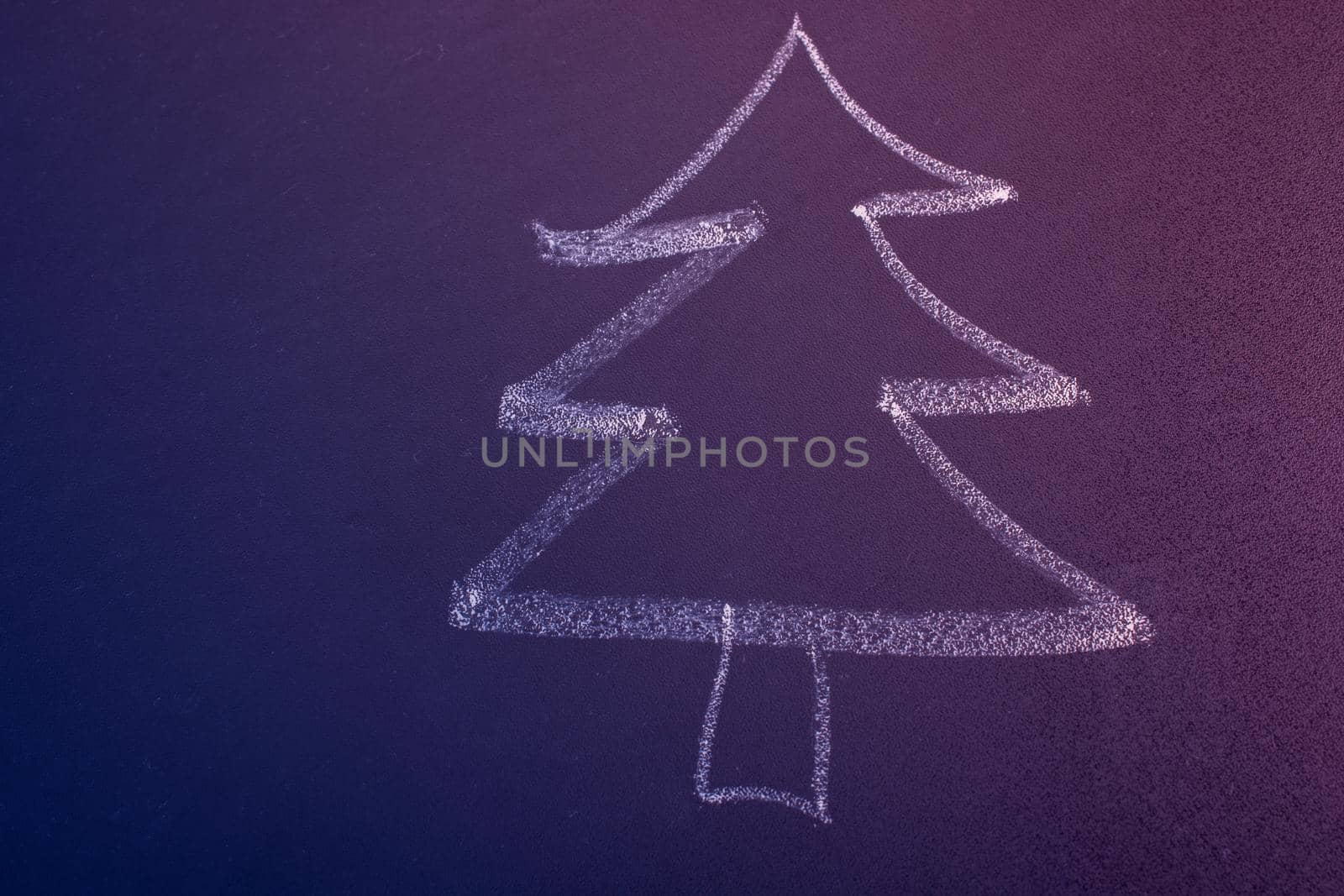 Hand drawing of tree with chalk on a blackboard