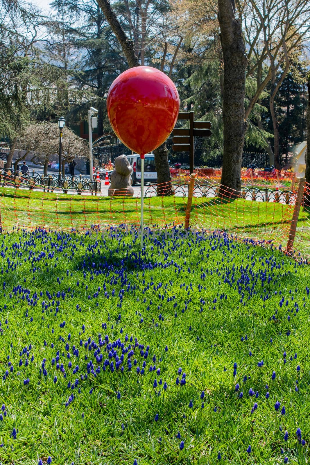 Decorative colorful balloons in the flower garden