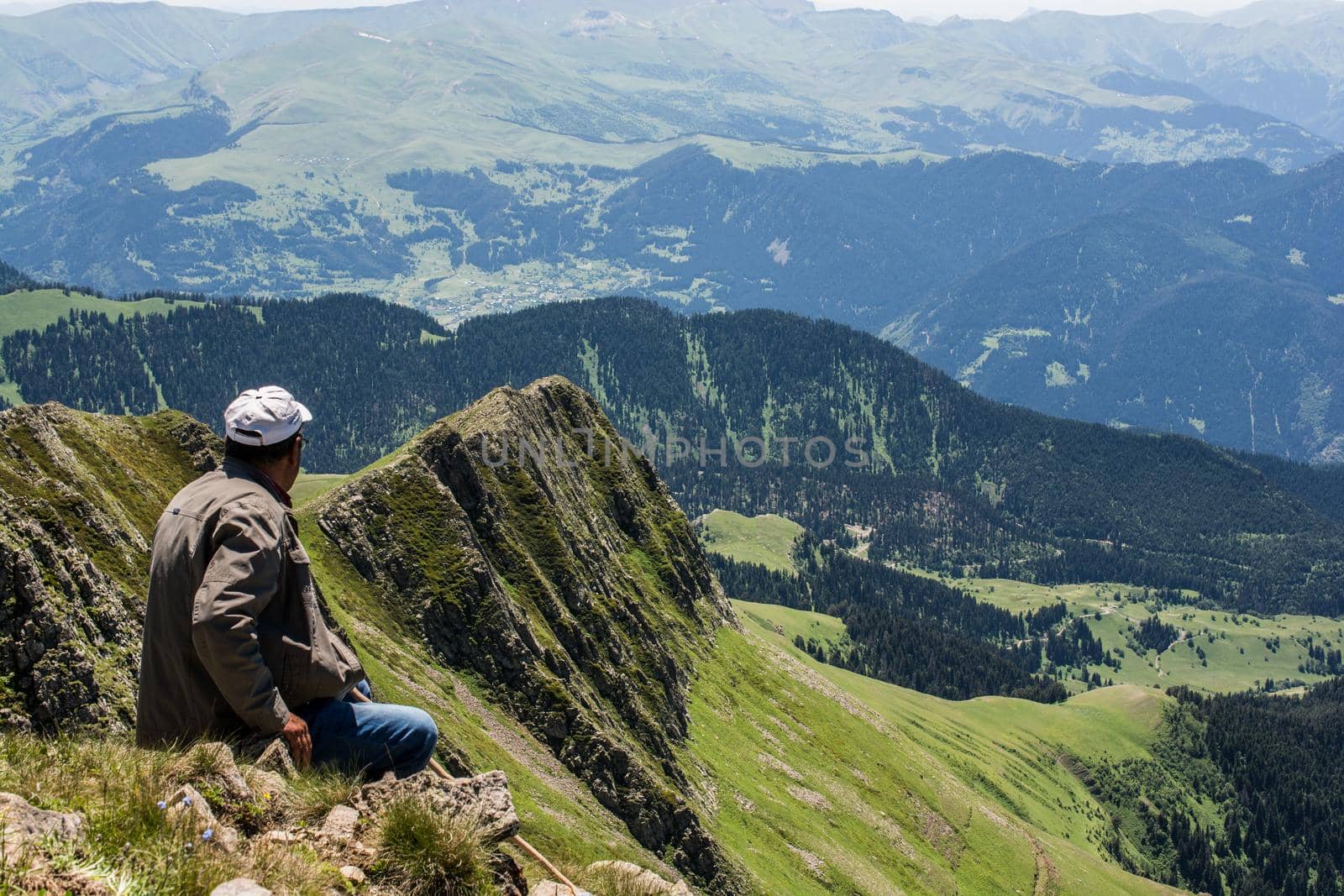 hikers with backpacks and trekking poles walking in Turkish highland