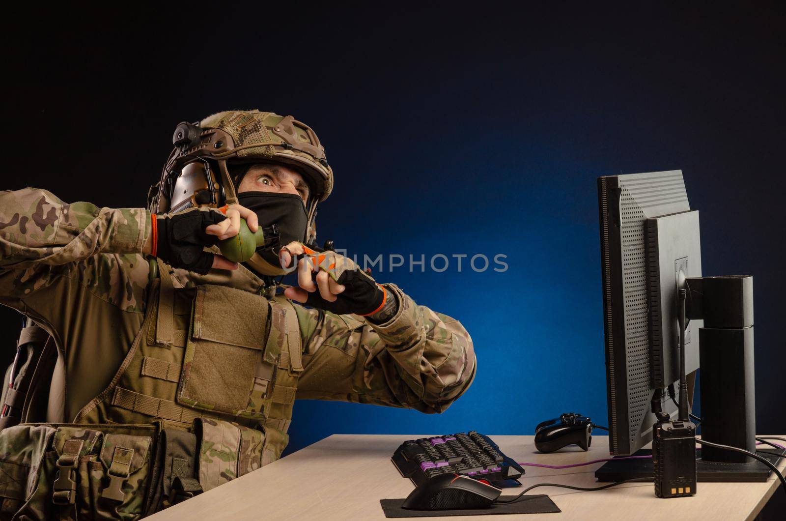 soldier sitting at a computer is conducting a cyber war by Rotozey