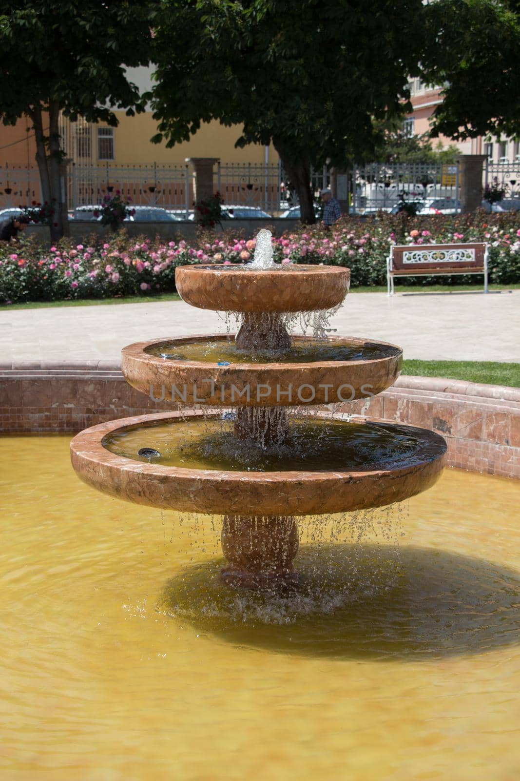 Water gushing off the fountain in the garden by berkay