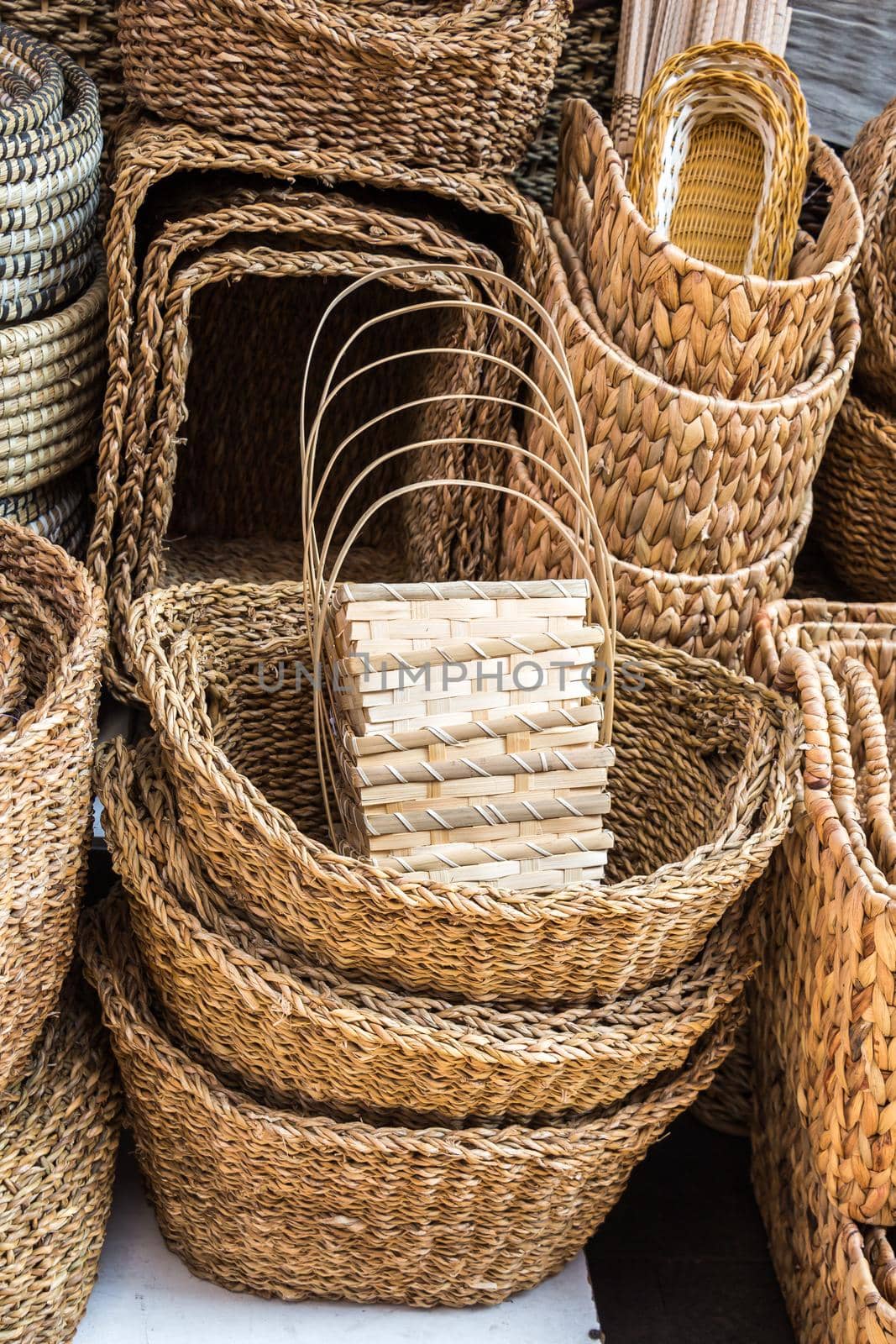 Empty wicker baskets are for sale in a market place