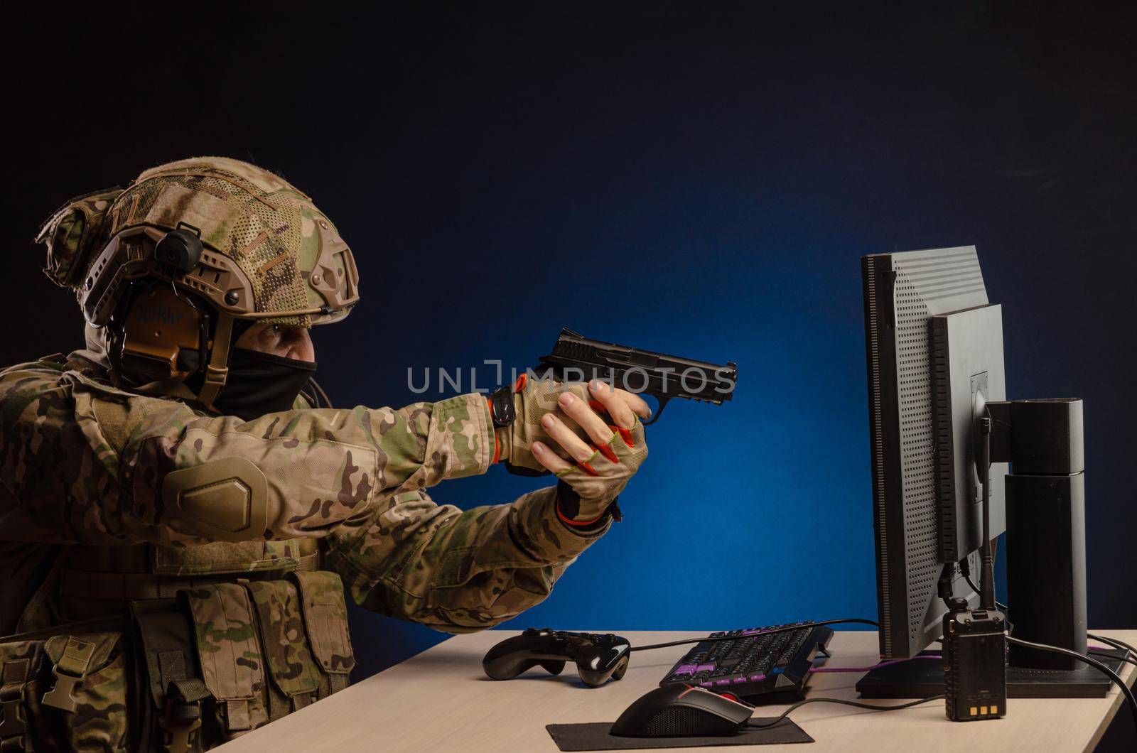 soldier sitting at a computer is conducting a cyber war by Rotozey