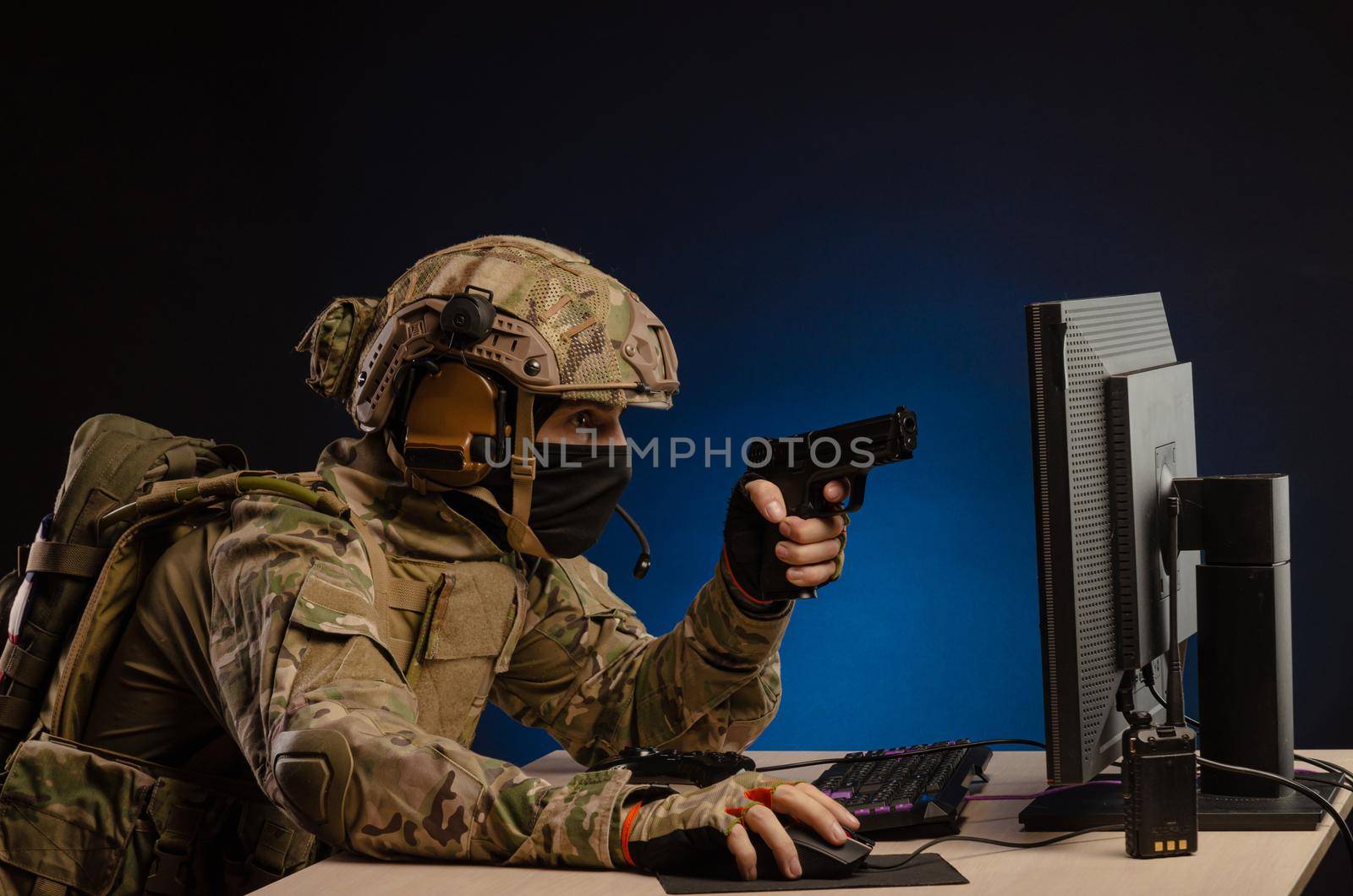 soldier sitting at a computer is conducting a cyber war