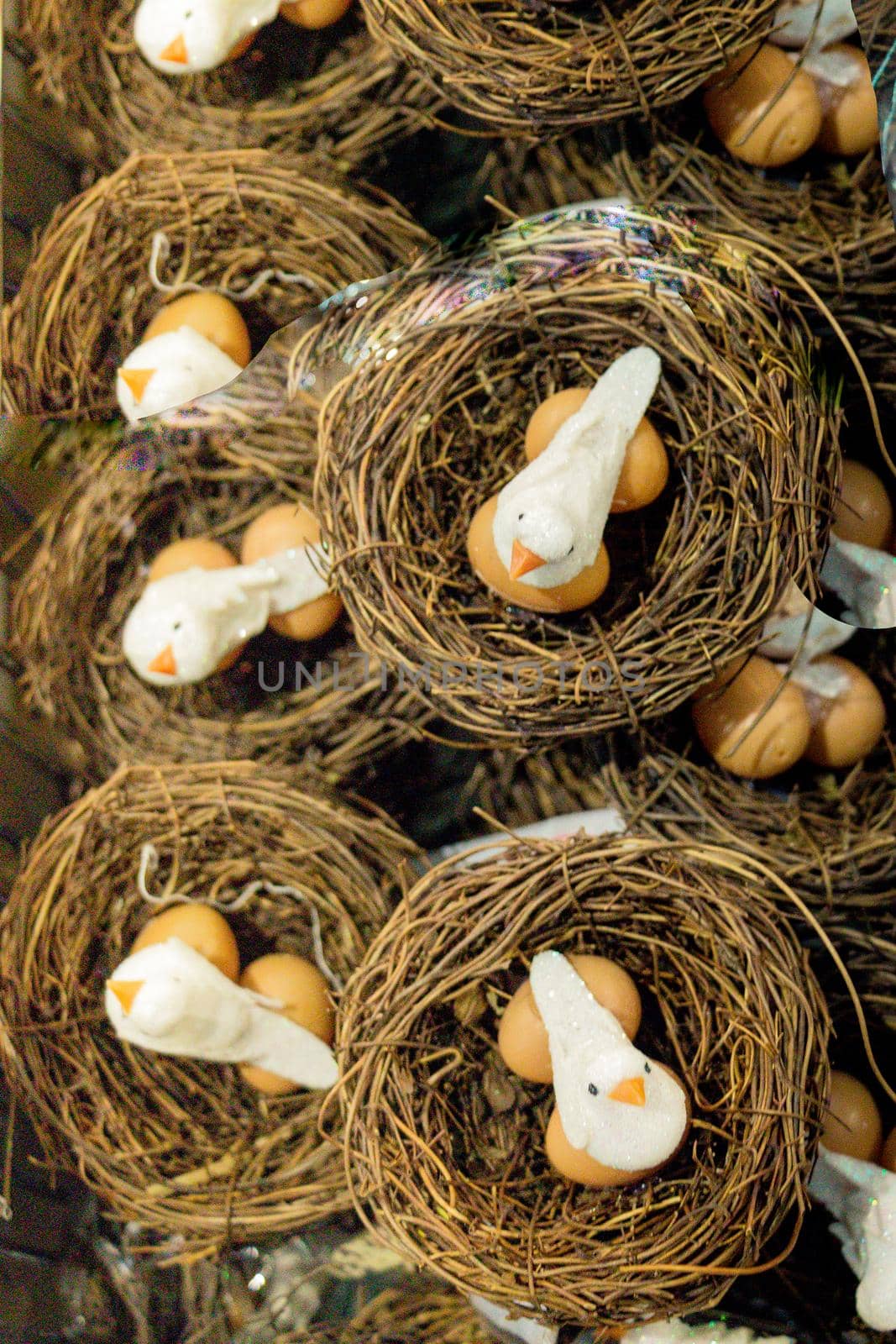 The small artificial bird nest with fake eggs in it by berkay