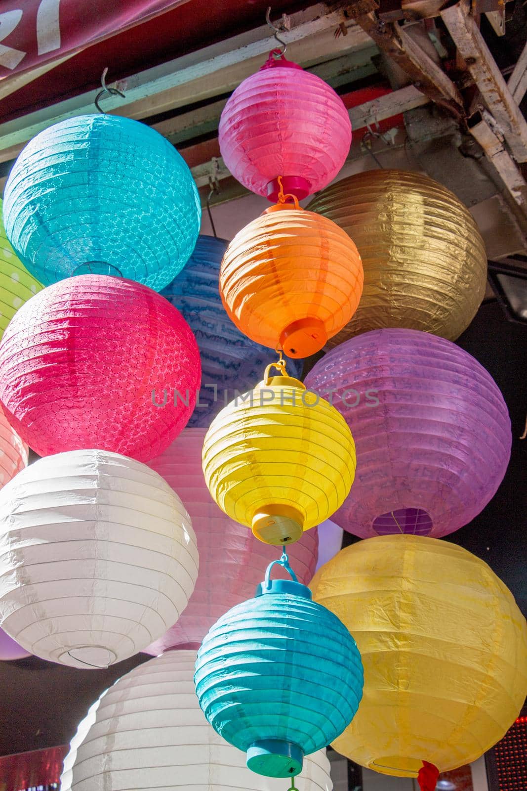 Colorful paper lantern outdoor in a marketplace by berkay