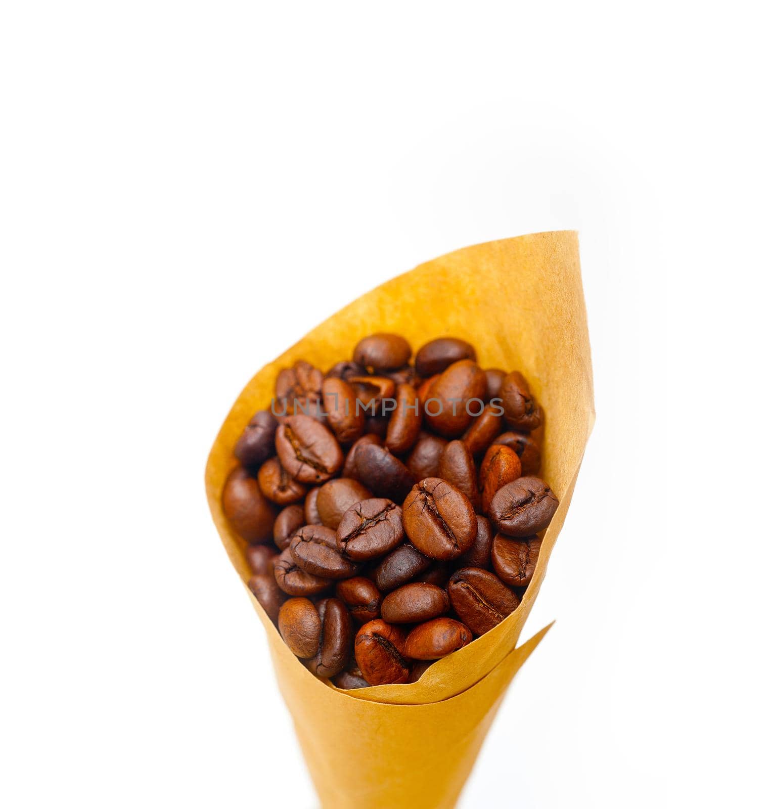 espresso coffee beans on a paper cone cornucopia over white background