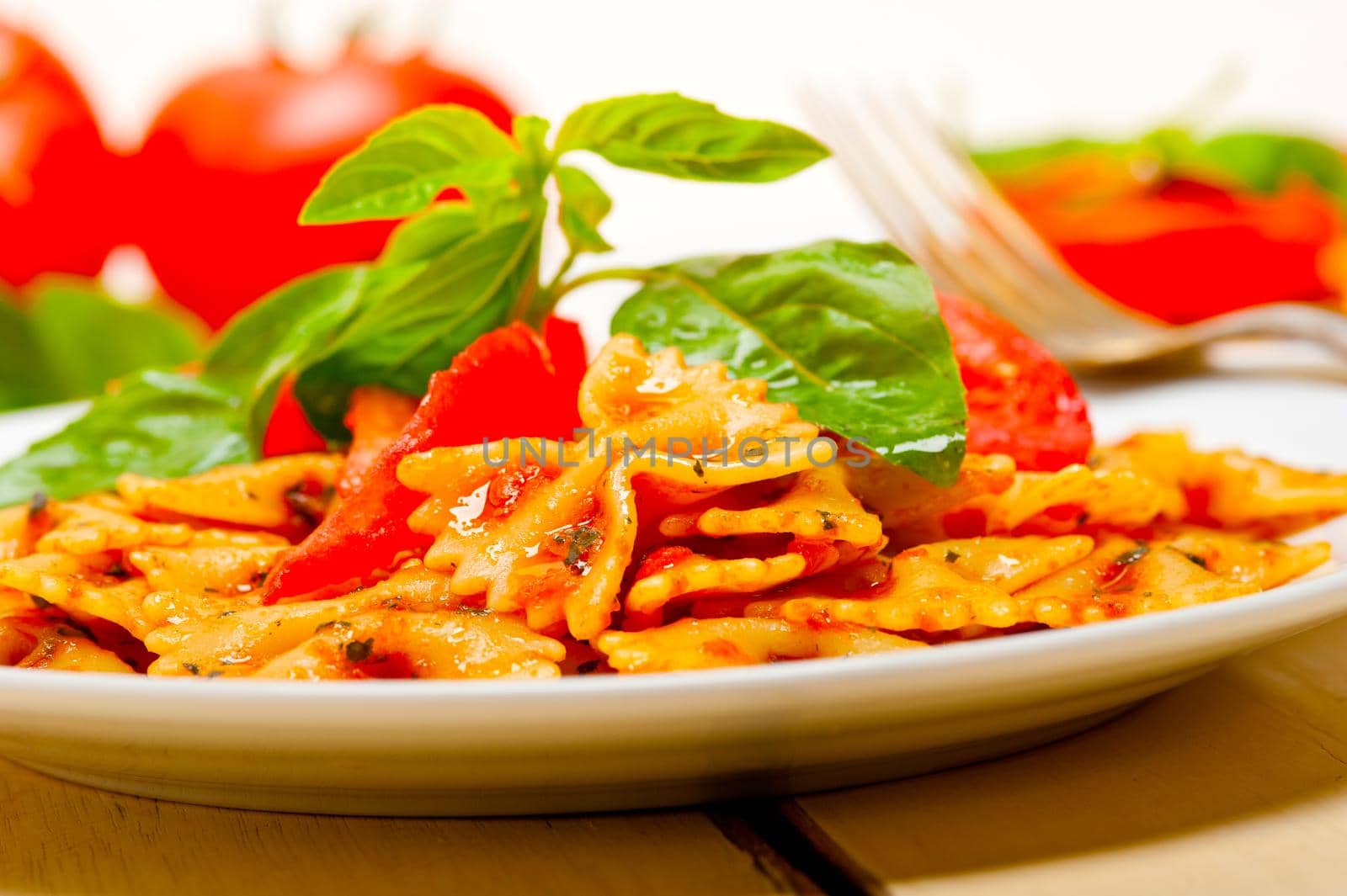 Italian pasta farfalle butterfly bow-tie and tomato sauce by keko64