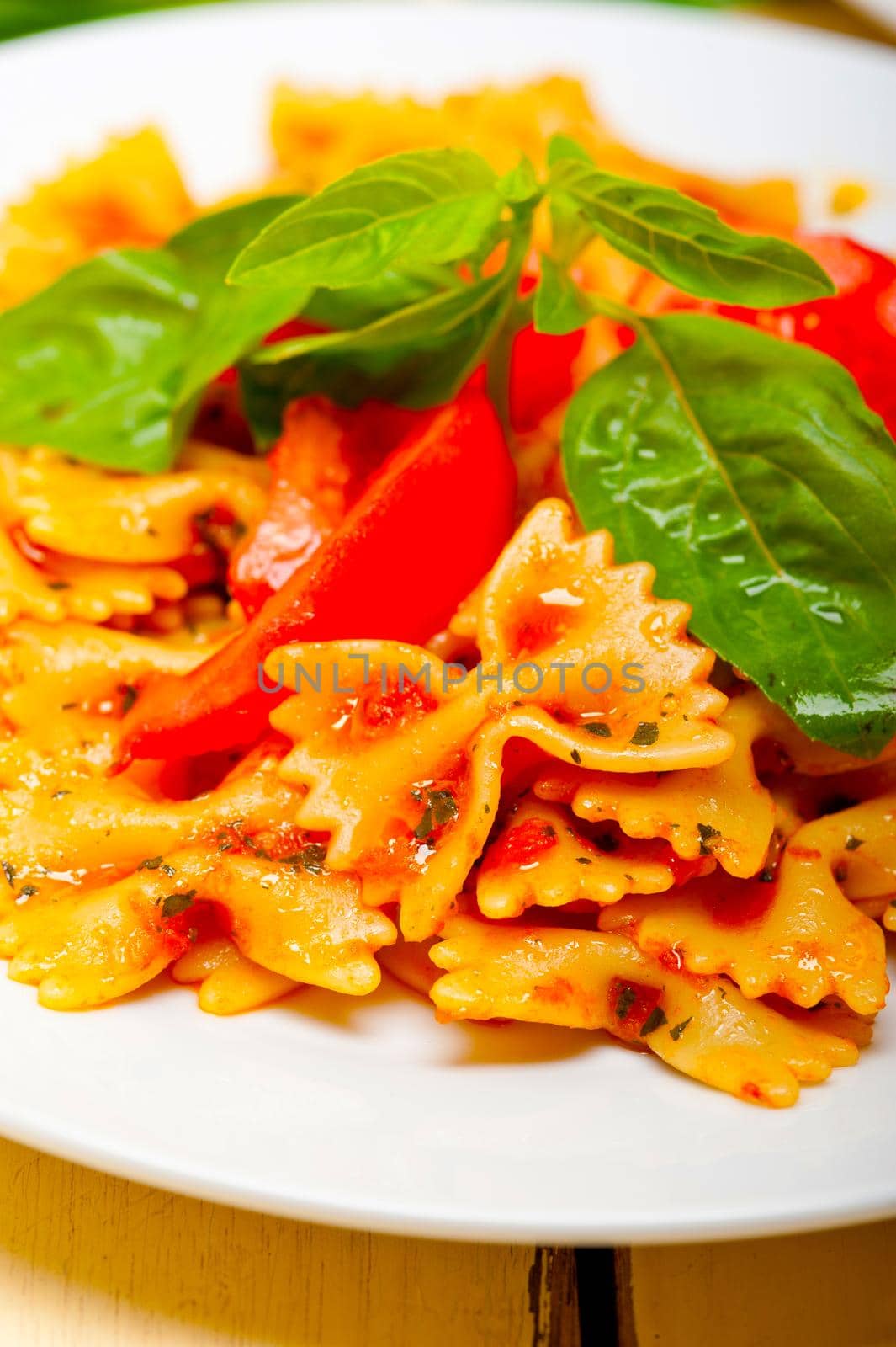 Italian pasta farfalle butterfly bow-tie and tomato sauce by keko64