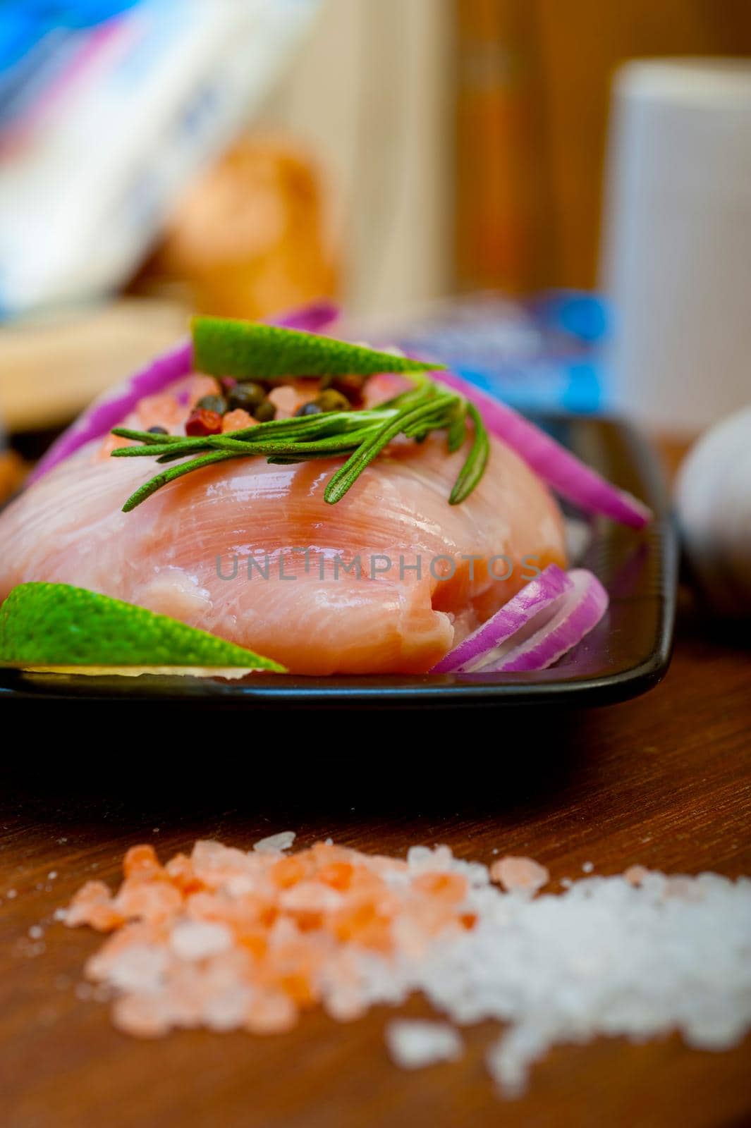 fresh organic chicken breast with herbs and spices