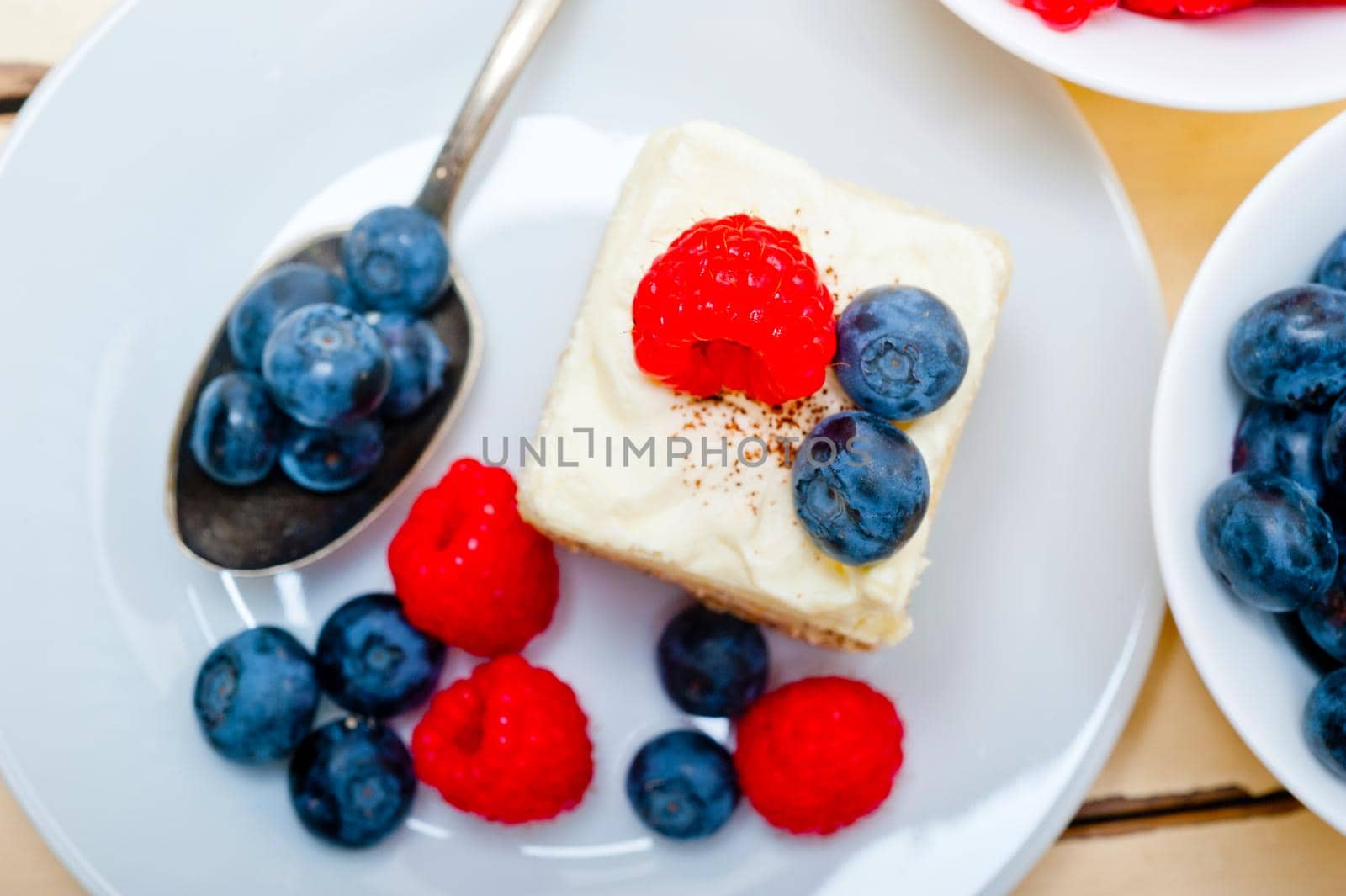 fresh homemade raspberry and blueberry cream cake 