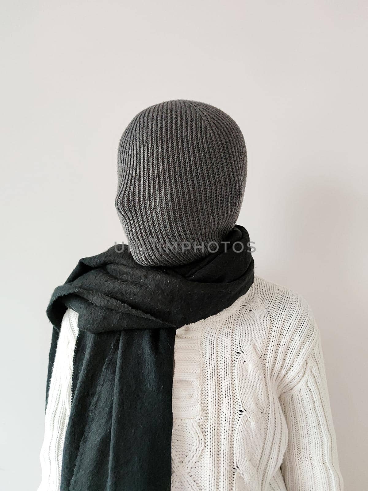 girl with a closed knitted fabric face in a white sweater and black scarf by Annado