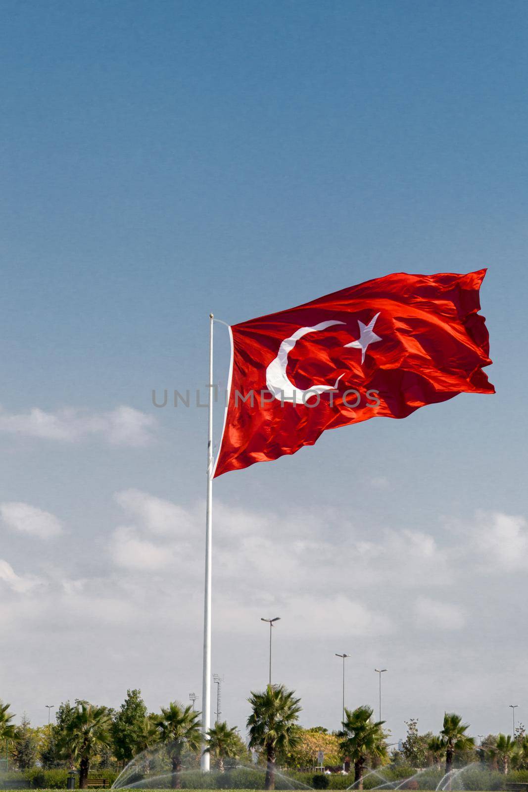 Turkish national flag with white star and moon in view by berkay