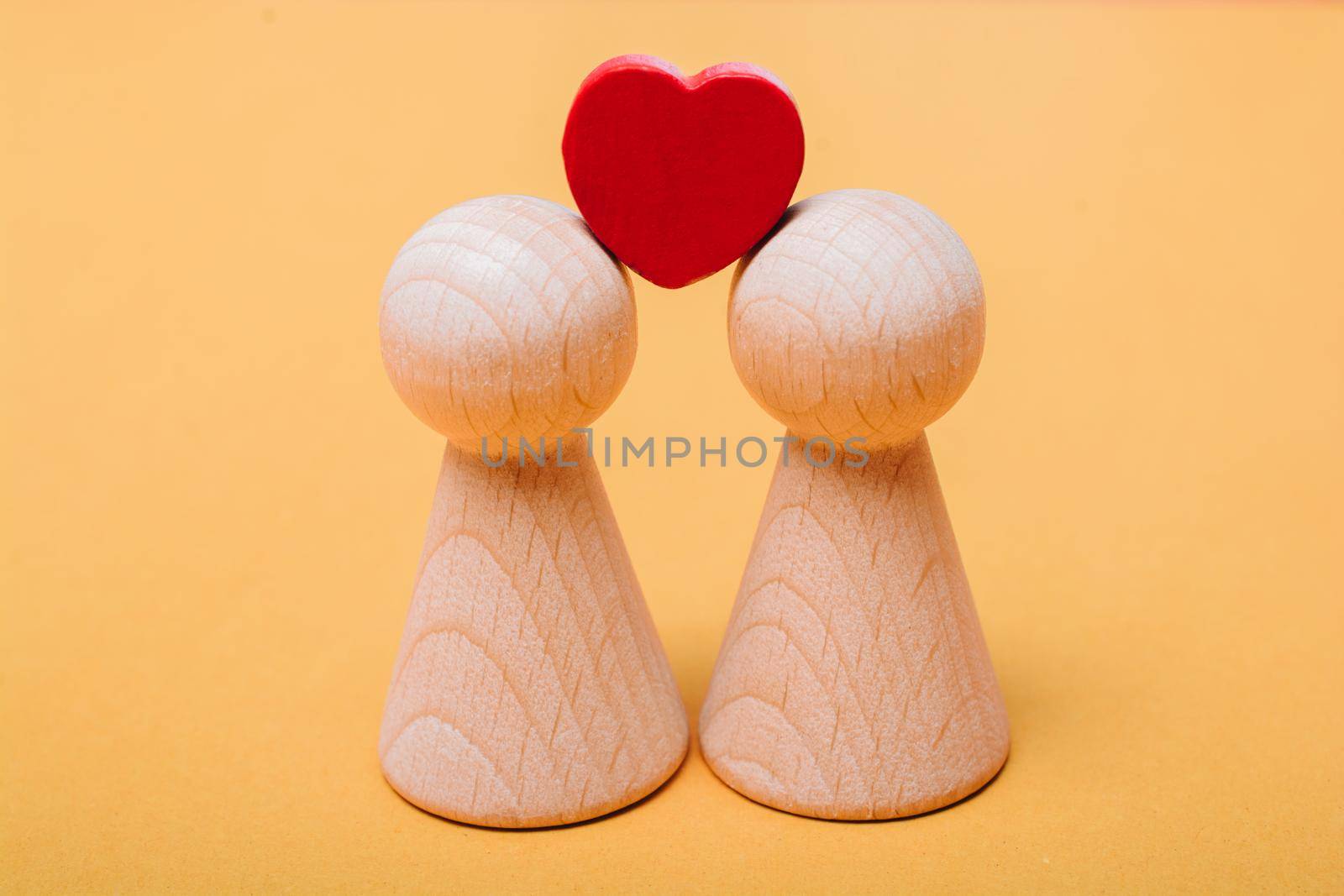 Wooden figurines of  family as concept of caring for children